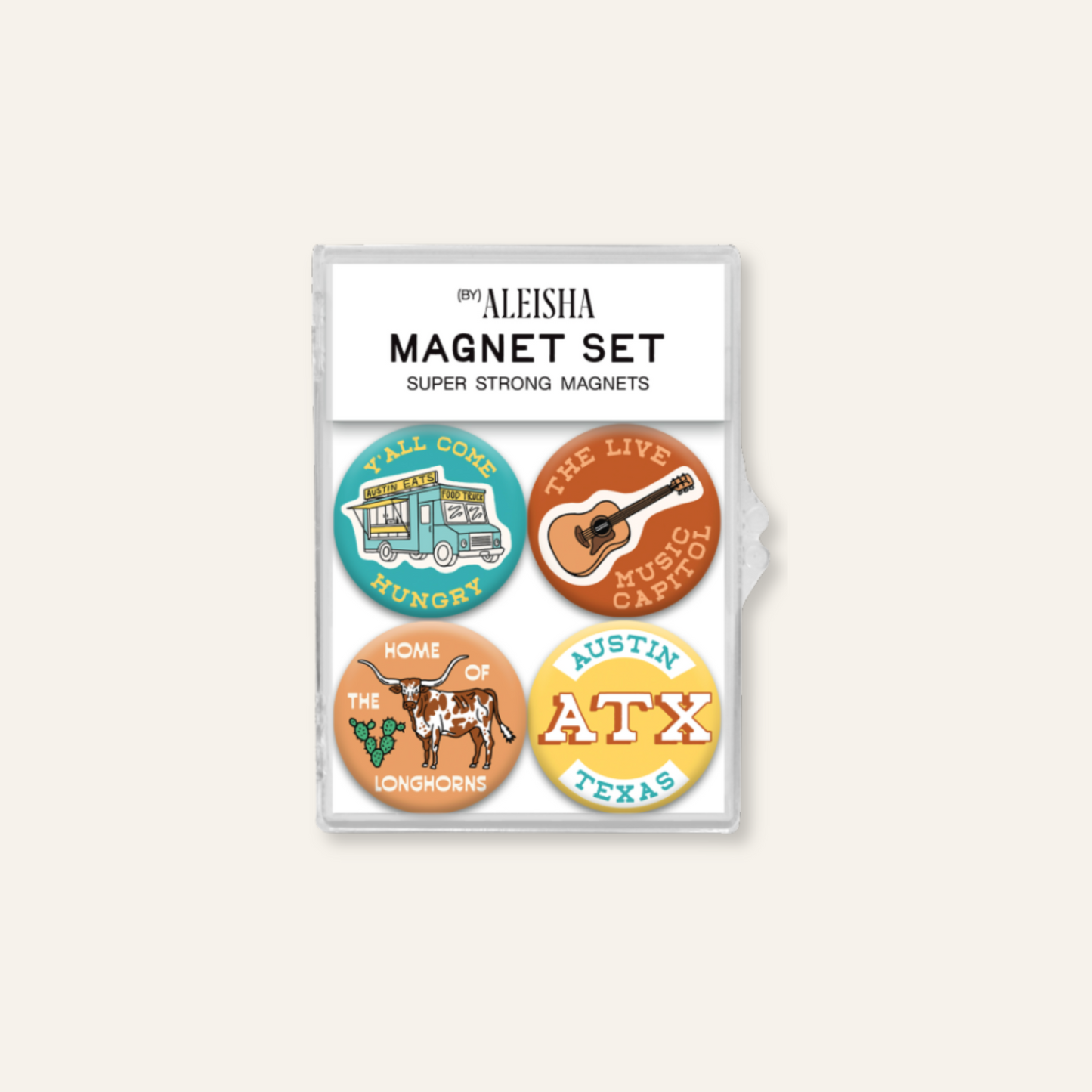 A 4-piece magnet set in a clear plastic sleeve on a light beige background. The magnets feature Texas-themed designs including a teal Austin magnet, a brown guitar magnet, a yellow ATX magnet, and an orange cow magnet.