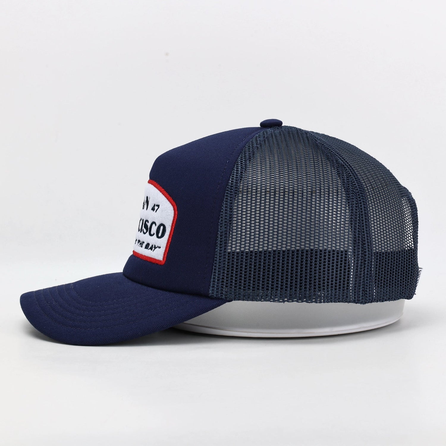 San Francisco embroidered patch on navy blue trucker hat