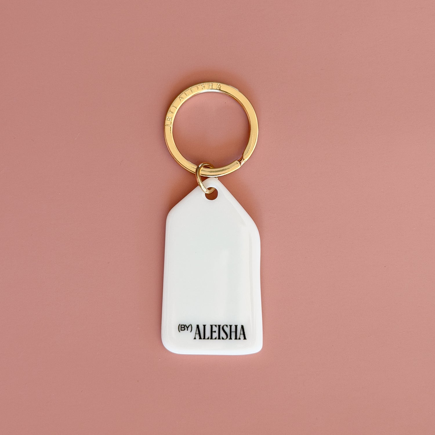 Hand-illustrated San Francisco keychain featuring a Painted Lady Victorian home