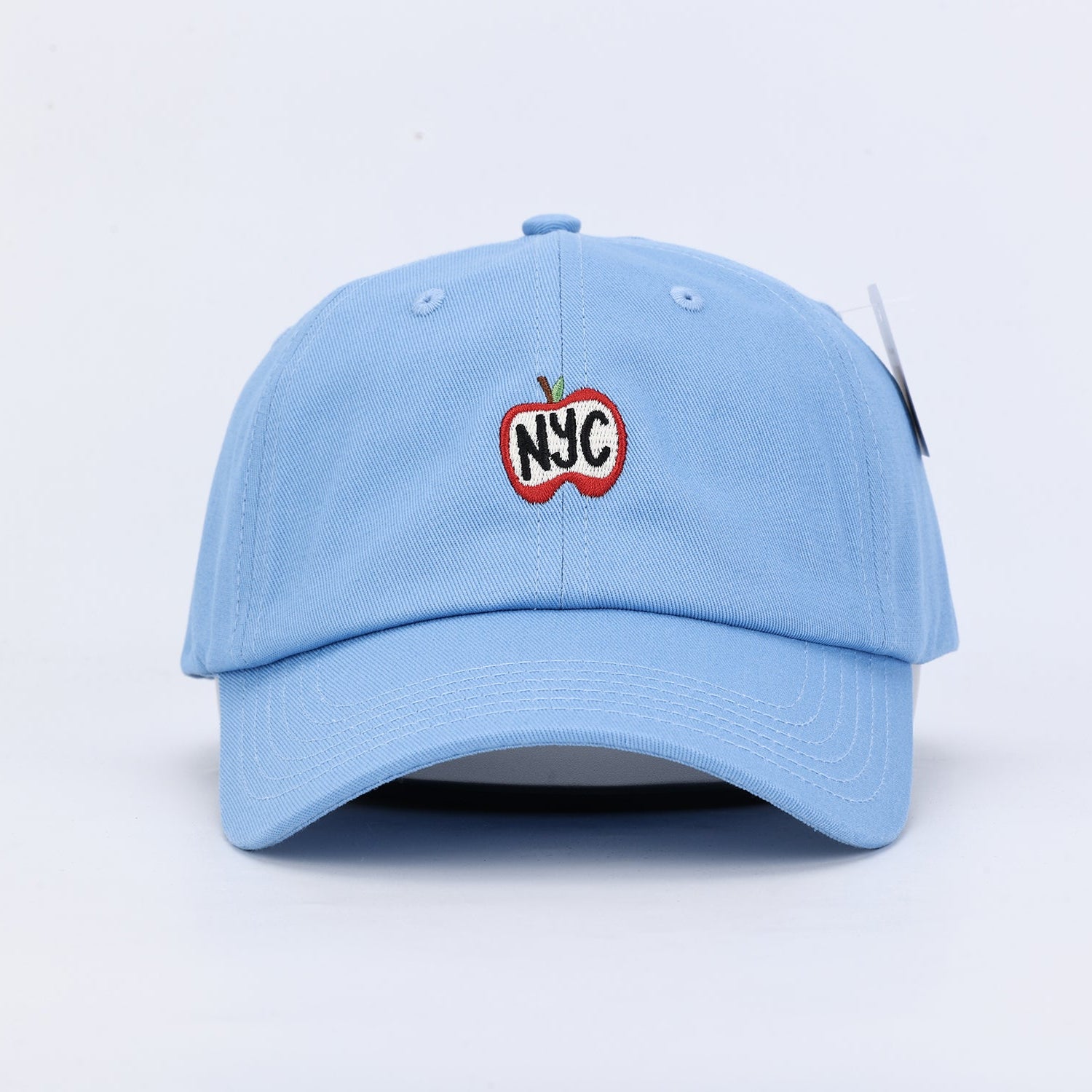 Light blue dad hat with an apple embroidered on the front 