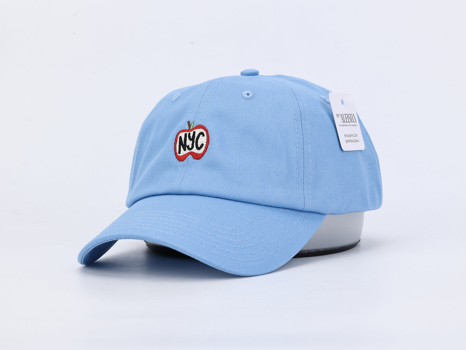 Light Blue Dad Hat with an apple embroidered on the front