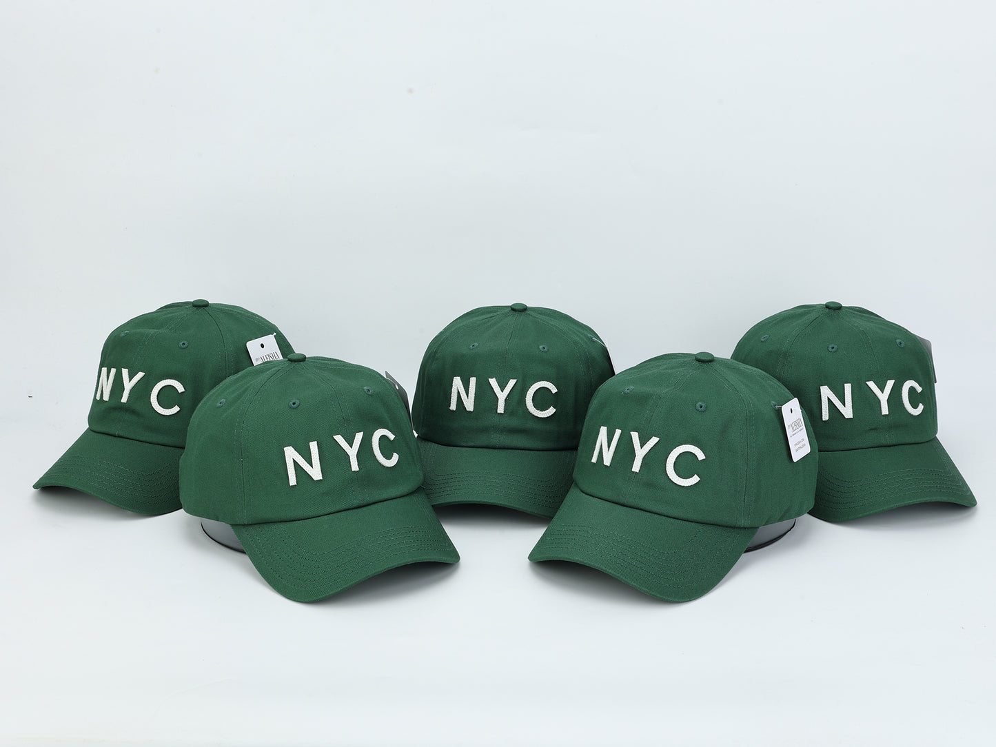 A collection of 5 Forest Green NYC Dad Hats
