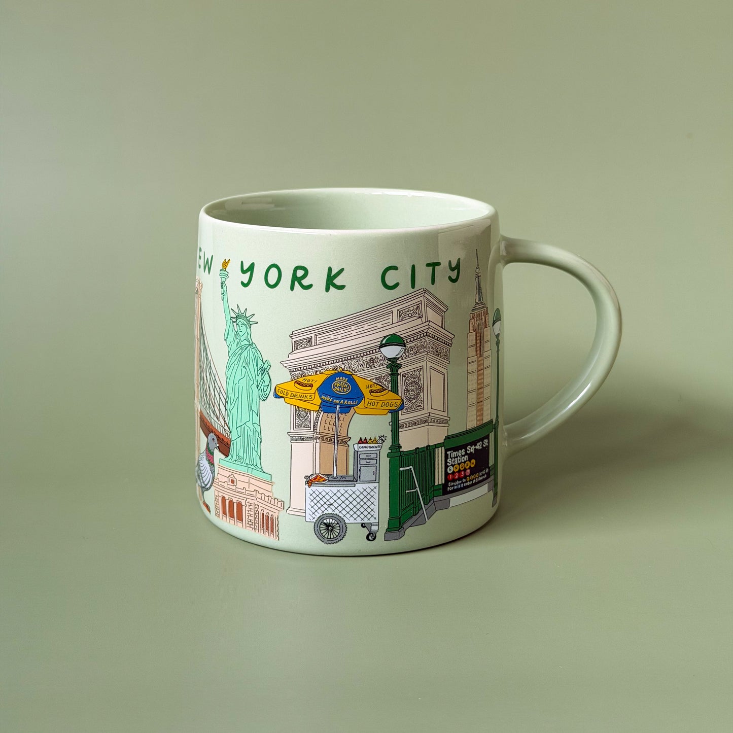 Ceramic mug with Aleisha's hand-illustrated New York City Icons wrapped around the sides